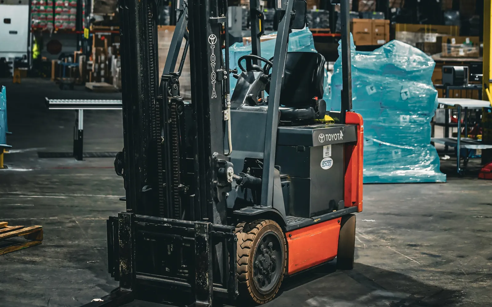 Used Toyota electric counterbalanced forklift in a warehouse, for sale in the Richmond metro